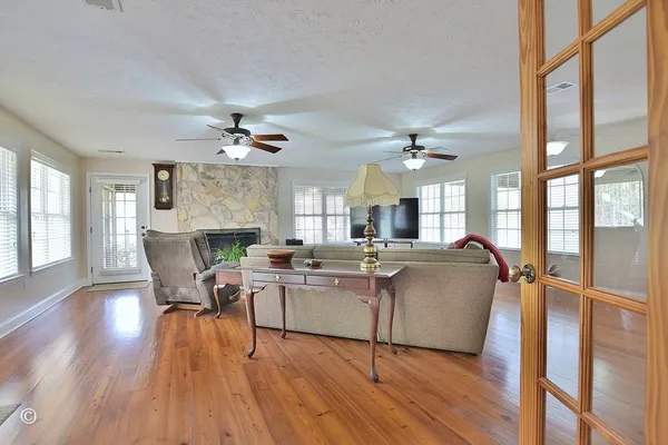 a living room with furniture and a flat screen tv