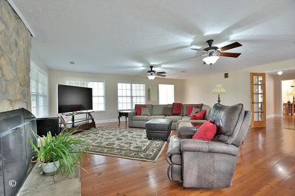 a living room with furniture and a window