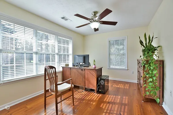 a bedroom with a large bed and a large window
