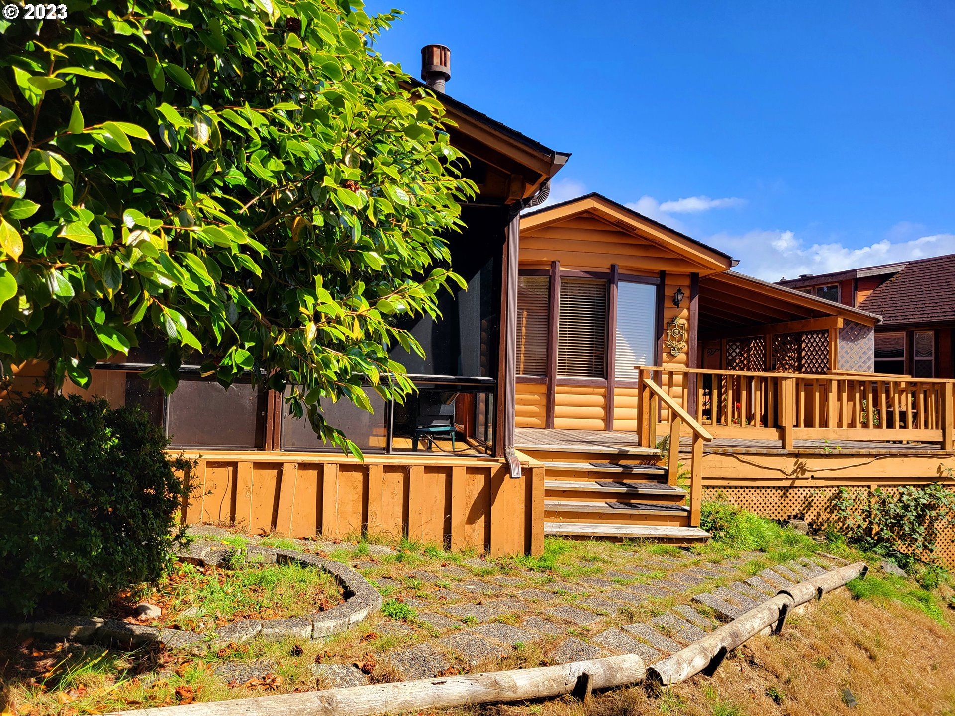 19921 Whaleshead Road, Unit OV8 Brookings, OR 97415 - Photo 17 of 48 a view of a house with a small yard