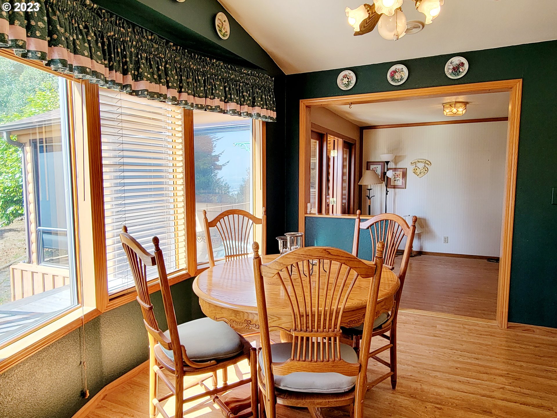 19921 Whaleshead Road, Unit OV8 Brookings, OR 97415 - Photo 19 of 48 a view of a dining room with furniture and wooden floor
