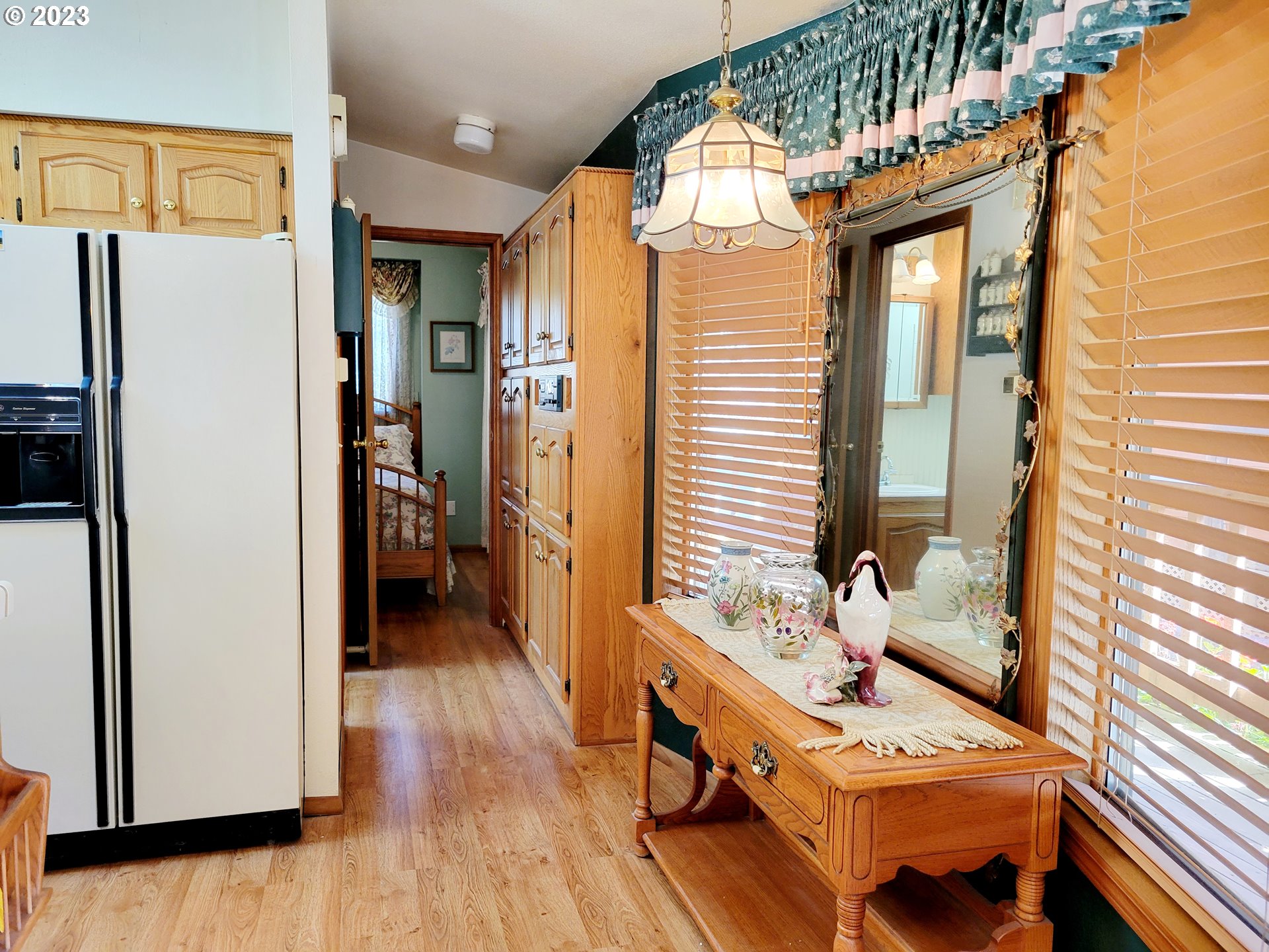 19921 Whaleshead Road, Unit OV8 Brookings, OR 97415 - Photo 22 of 48 a view of a hallway with furniture and a window