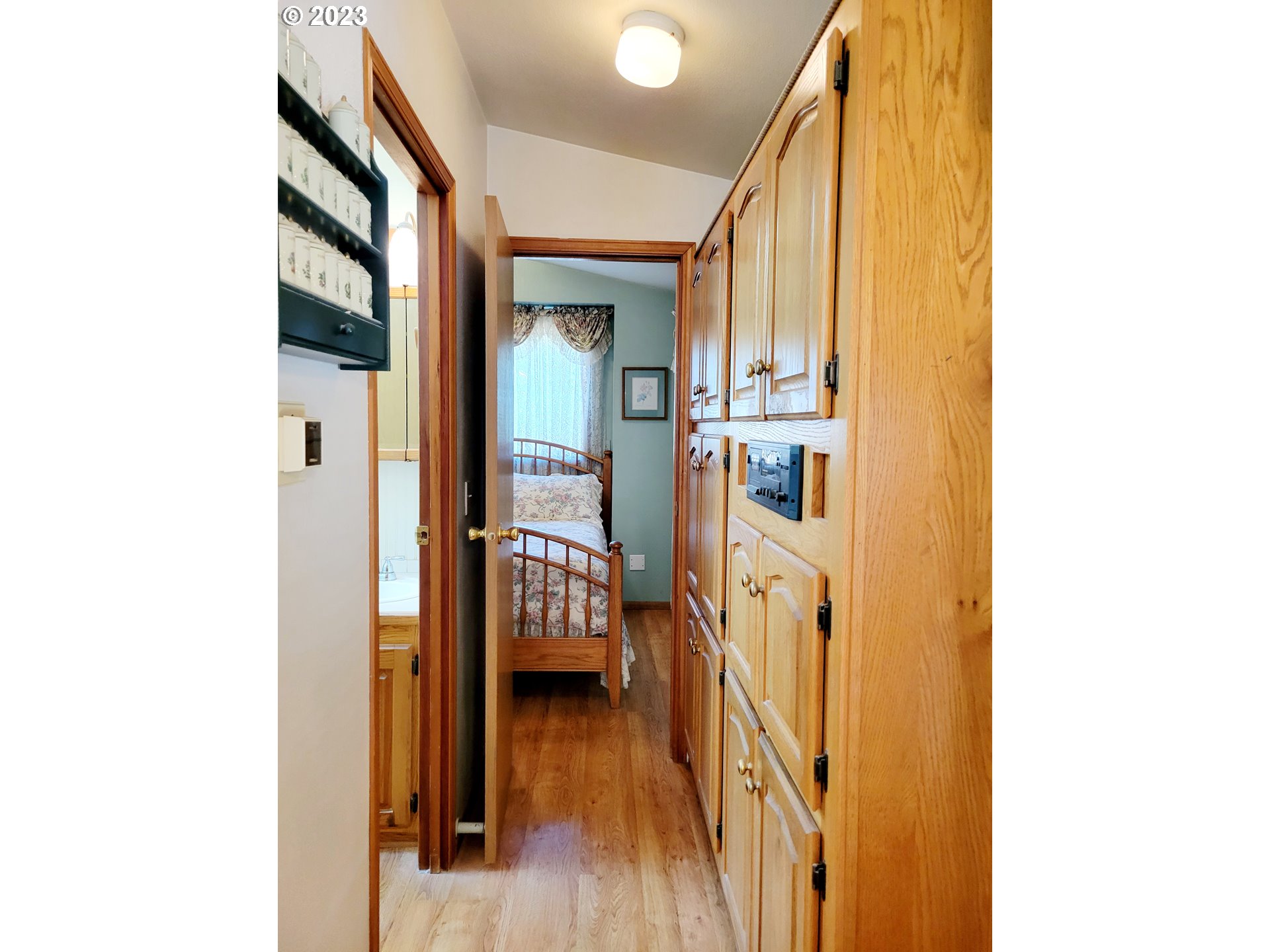 19921 Whaleshead Road, Unit OV8 Brookings, OR 97415 - Photo 24 of 48 a view of a hallway with wooden floor