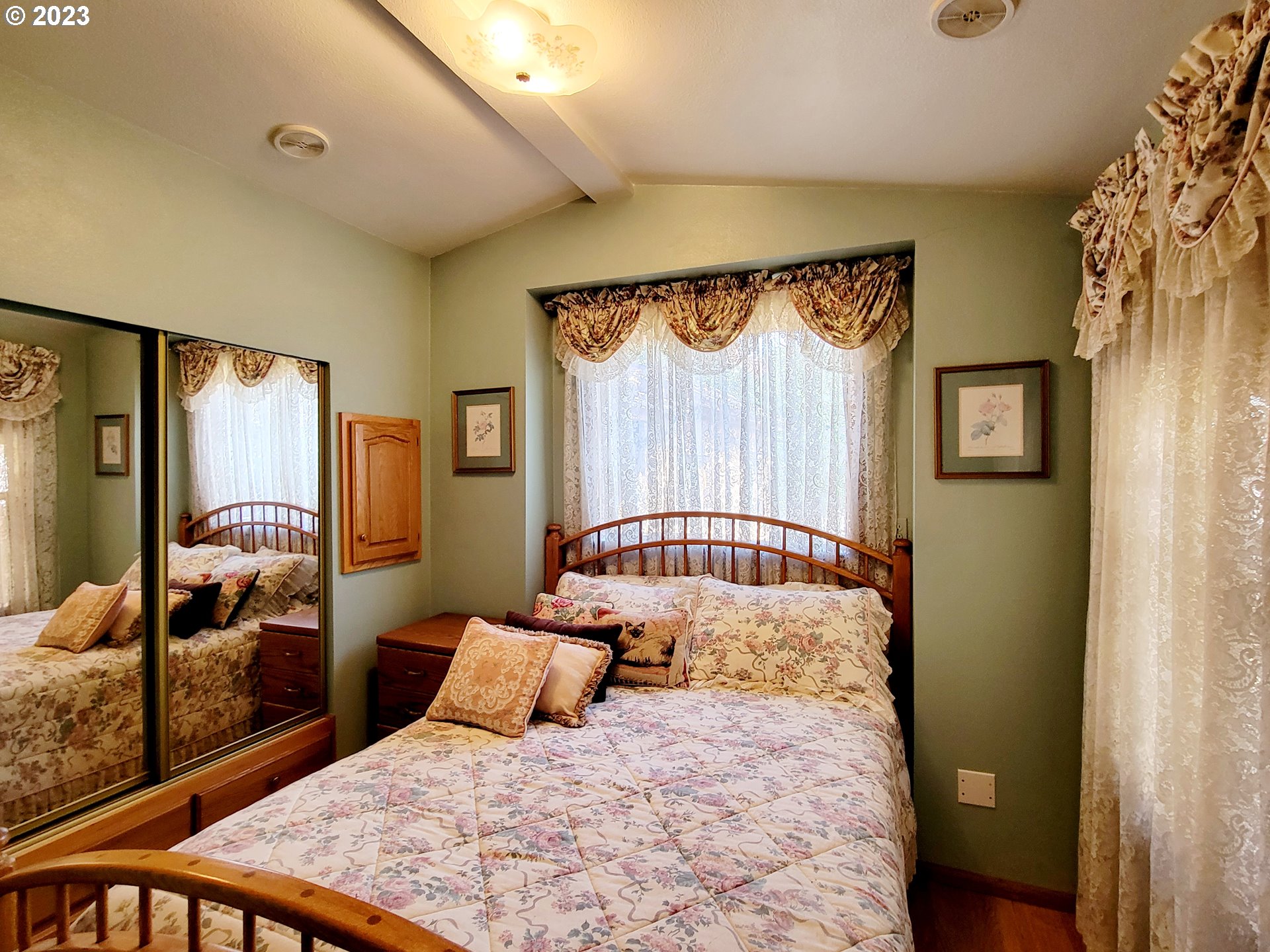 19921 Whaleshead Road, Unit OV8 Brookings, OR 97415 - Photo 26 of 48 a bedroom with a large bed and a dresser