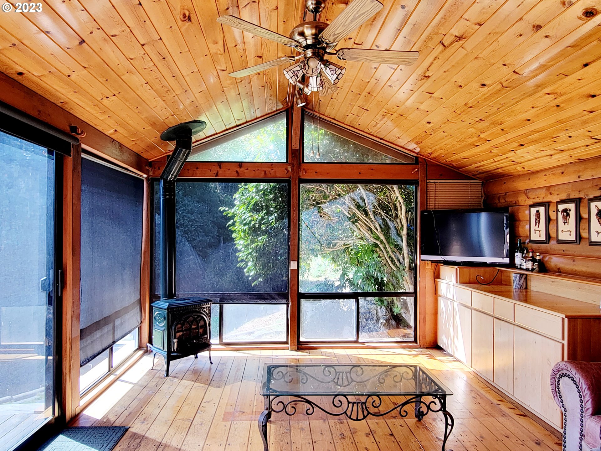 19921 Whaleshead Road, Unit OV8 Brookings, OR 97415 - Photo 34 of 48 a view of a room with a large window and wooden floor