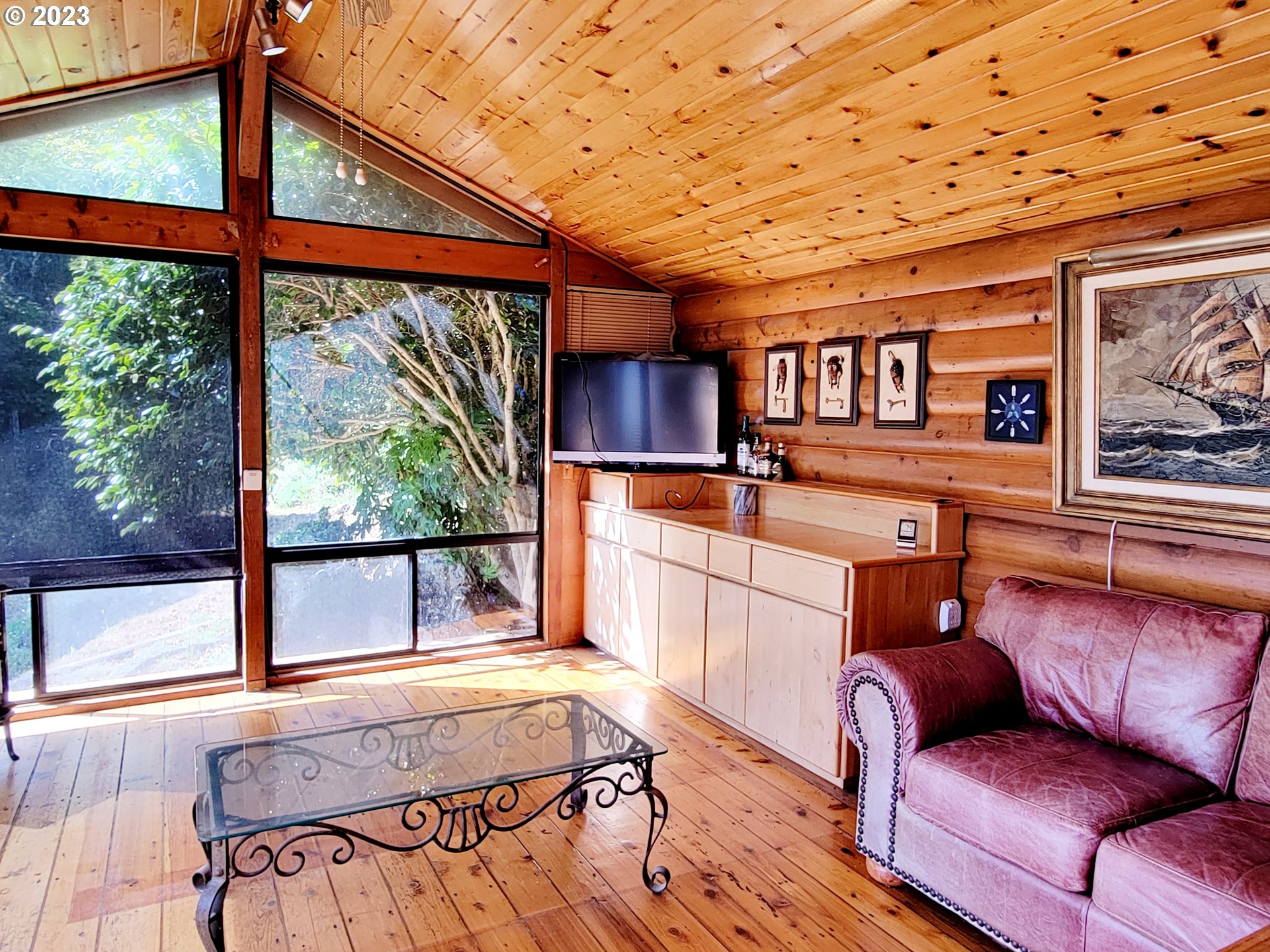 19921 Whaleshead Road, Unit OV8 Brookings, OR 97415 - Photo 35 of 48 a living room with furniture and a large window