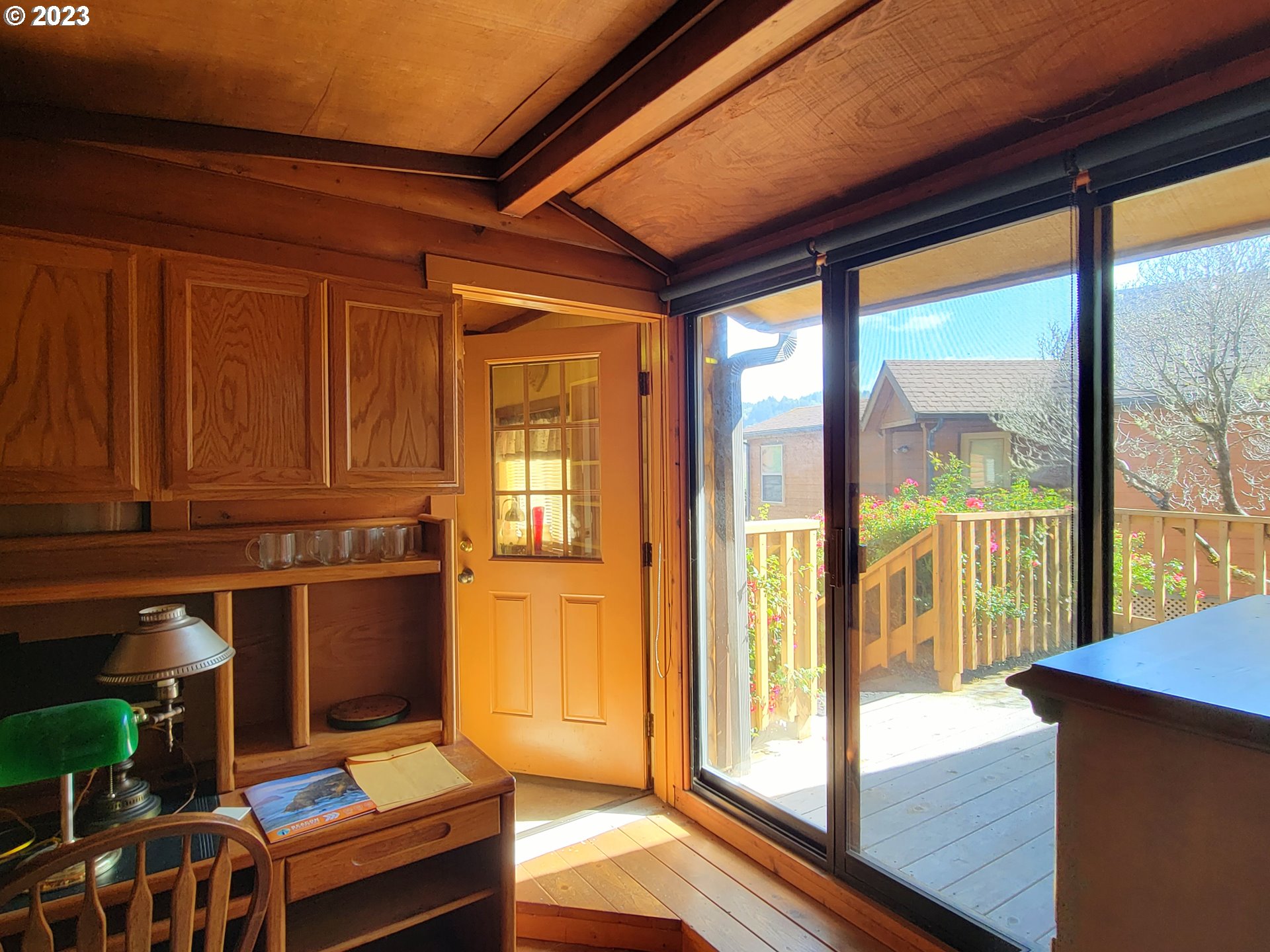 19921 Whaleshead Road, Unit OV8 Brookings, OR 97415 - Photo 40 of 48 a workspace with wooden floor and a window