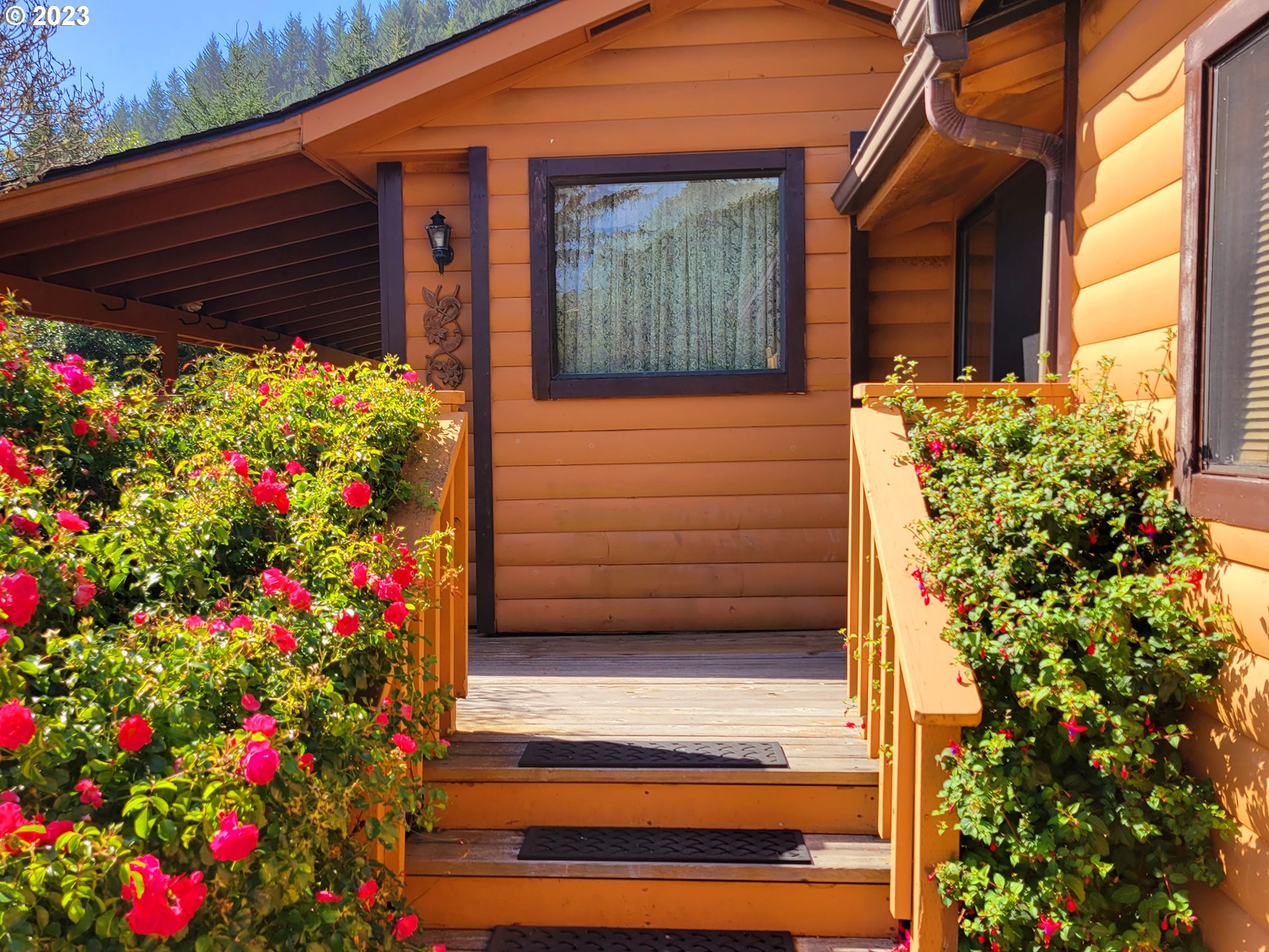 19921 Whaleshead Road, Unit OV8 Brookings, OR 97415 - Photo 7 of 48 a front view of a house with a garage