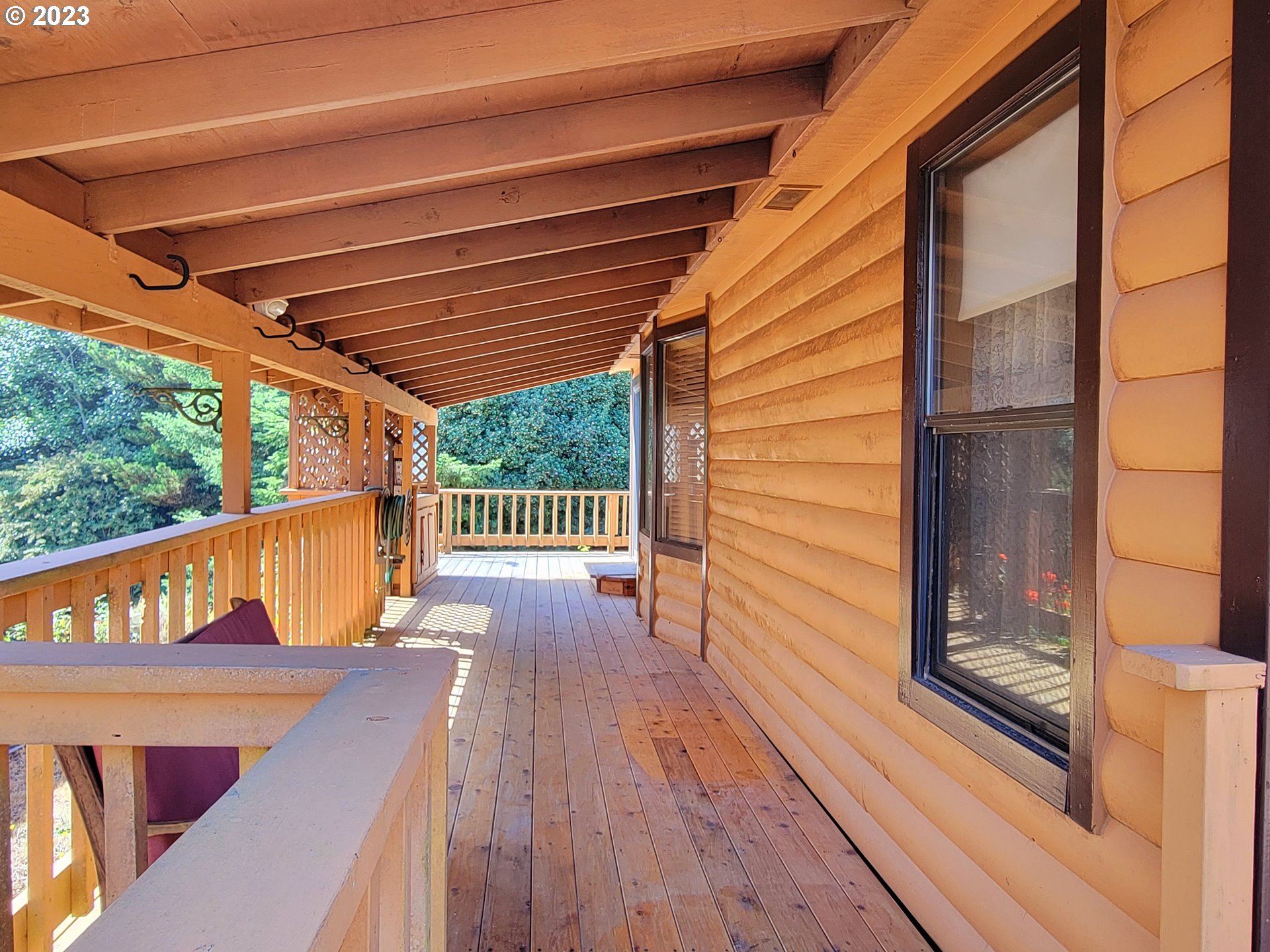 19921 Whaleshead Road, Unit OV8 Brookings, OR 97415 - Photo 10 of 48 a view of balcony with wooden floor