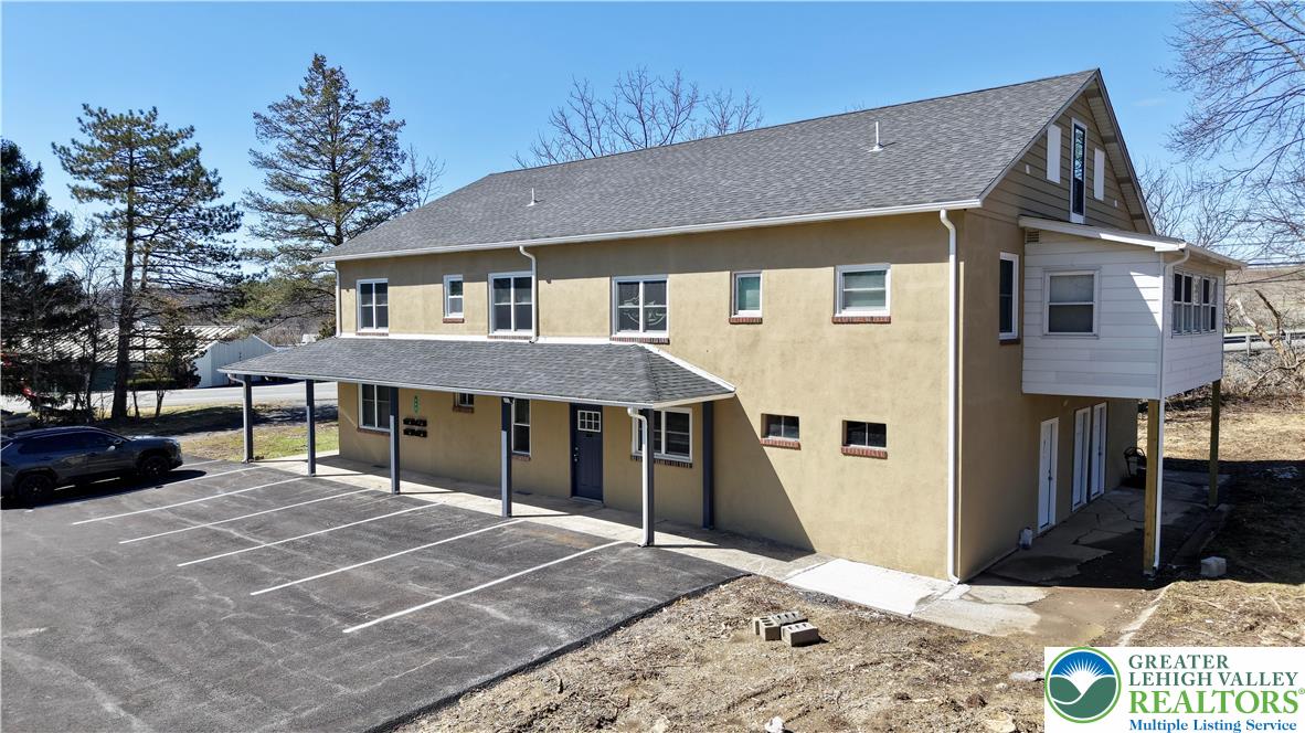 403 North Walnut Street, Unit B Bath, PA 18014 - Photo 2 of 31 a view of a house with a patio and a yard