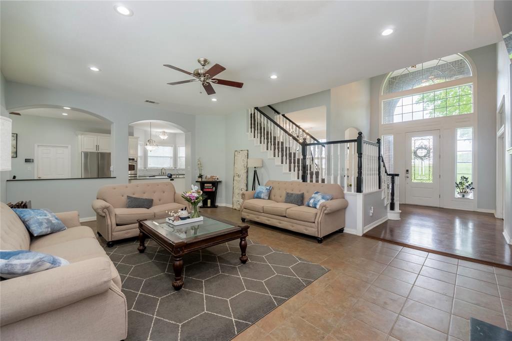 135 Kirkpatrick Road Ennis, TX 75119 - Photo 13 of 40 a living room with furniture and a large window