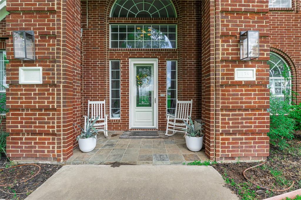 135 Kirkpatrick Road Ennis, TX 75119 - Photo 2 of 40 a view of a brick house with potted plants