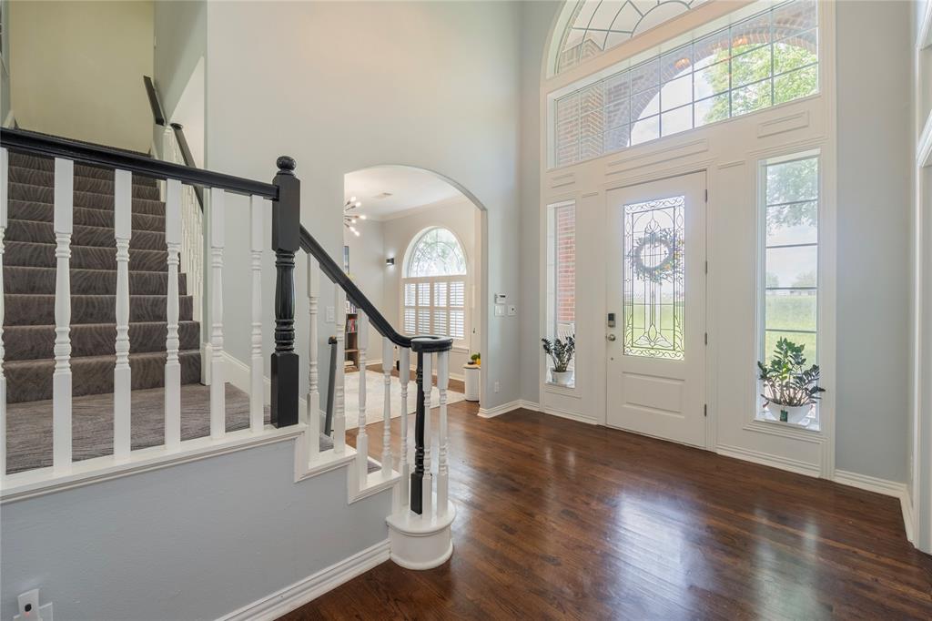 135 Kirkpatrick Road Ennis, TX 75119 - Photo 3 of 40 a view of an entryway with wooden floor door and a window