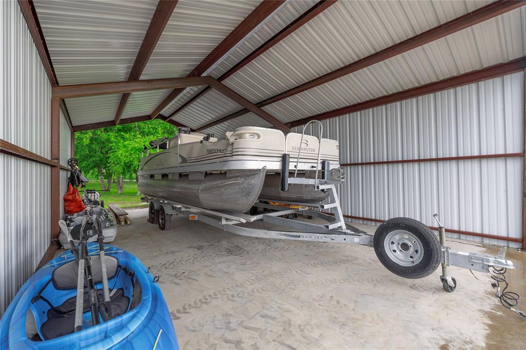 135 Kirkpatrick Road Ennis, TX 75119 - Photo 38 of 40 a view of car parked in garage