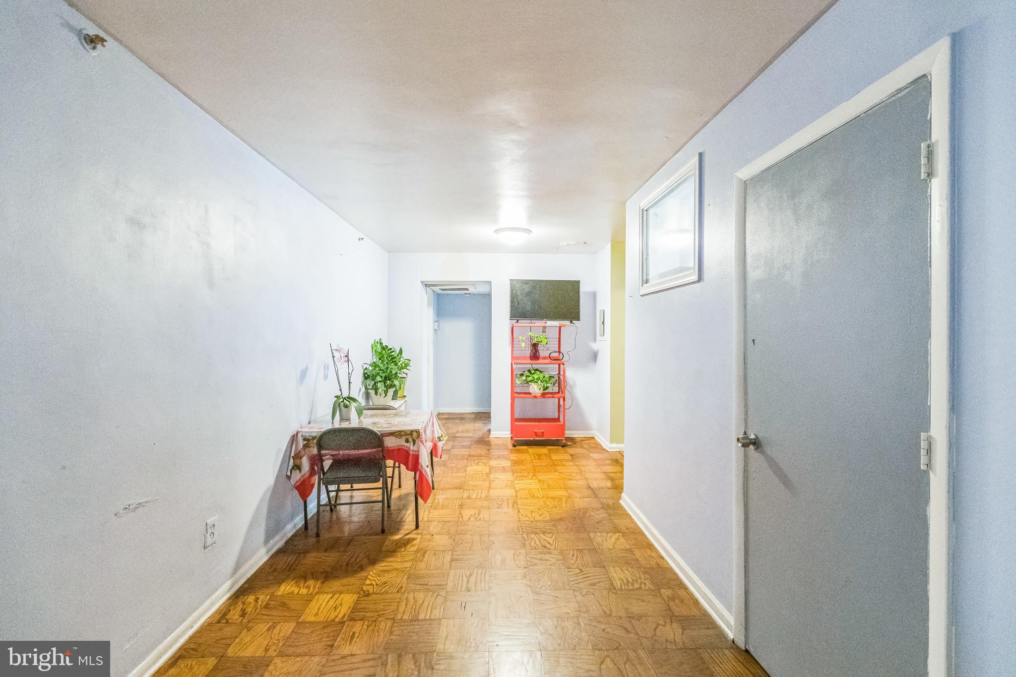 3902 14th Street Northwest, Unit 116 Washington, DC 20011 - Photo 3 of 14 a hallway with sliding door and entryway