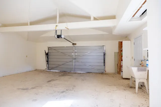 a view of room that has a bed