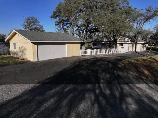 a view of a city with lush green forest