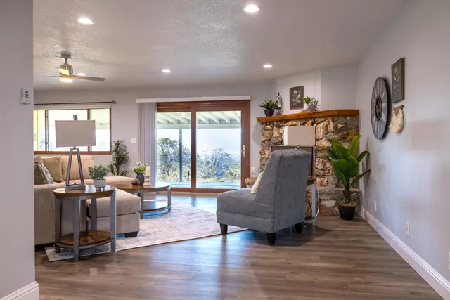 a living room with furniture window and wooden floor