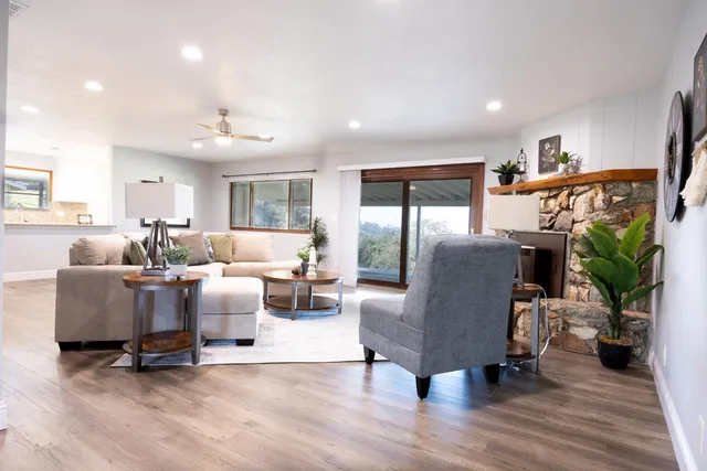 a living room with furniture and a fireplace