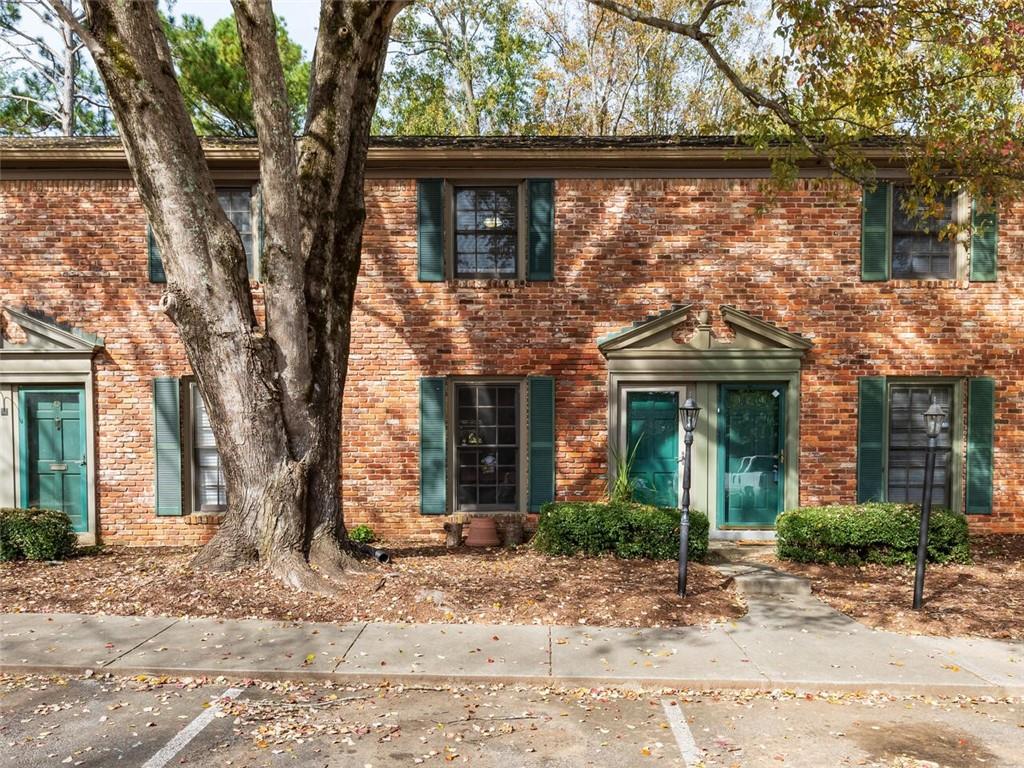 3103 Colonial Way, Unit D Chamblee, GA 30341 - Photo 1 of 1 Charming brick townhome in mature intown community full of trees.