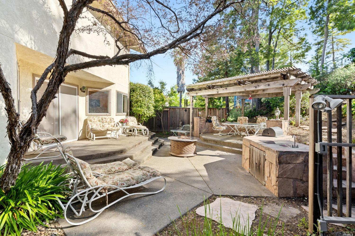 3525 Fieldcrest Avenue Fairfield, CA 94534 - Photo 16 of 31 a view of a patio with couches table and chairs and potted plants