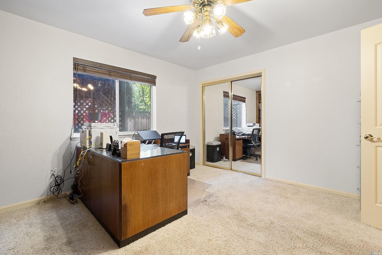 3525 Fieldcrest Avenue Fairfield, CA 94534 - Photo 27 of 31 a living room with furniture and a chandelier