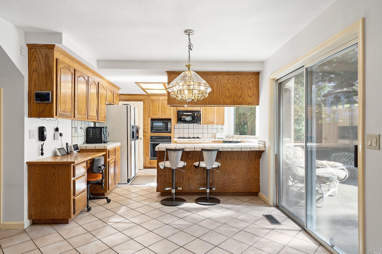 3525 Fieldcrest Avenue Fairfield, CA 94534 - Photo 10 of 31 a view of kitchen with granite countertop refrigerator and stove