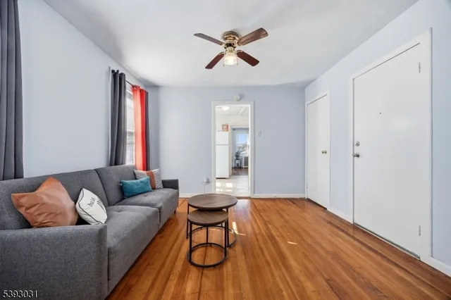 a kitchen with stainless steel appliances granite countertop a stove refrigerator and cabinets