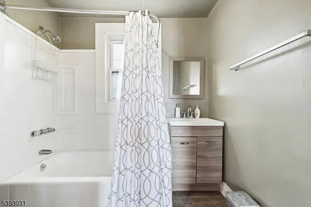 a kitchen with furniture a refrigerator and cabinets