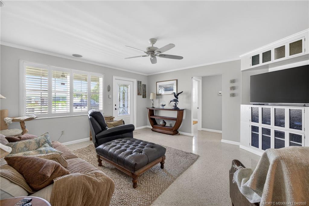 4844 Southeast Pilot Way Stuart, FL 34997 - Photo 24 of 50 a living room with furniture and a flat screen tv