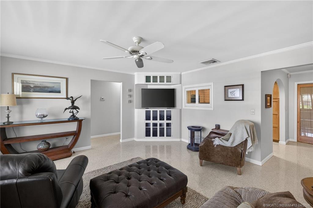 4844 Southeast Pilot Way Stuart, FL 34997 - Photo 26 of 50 a living room with furniture windows and a fireplace