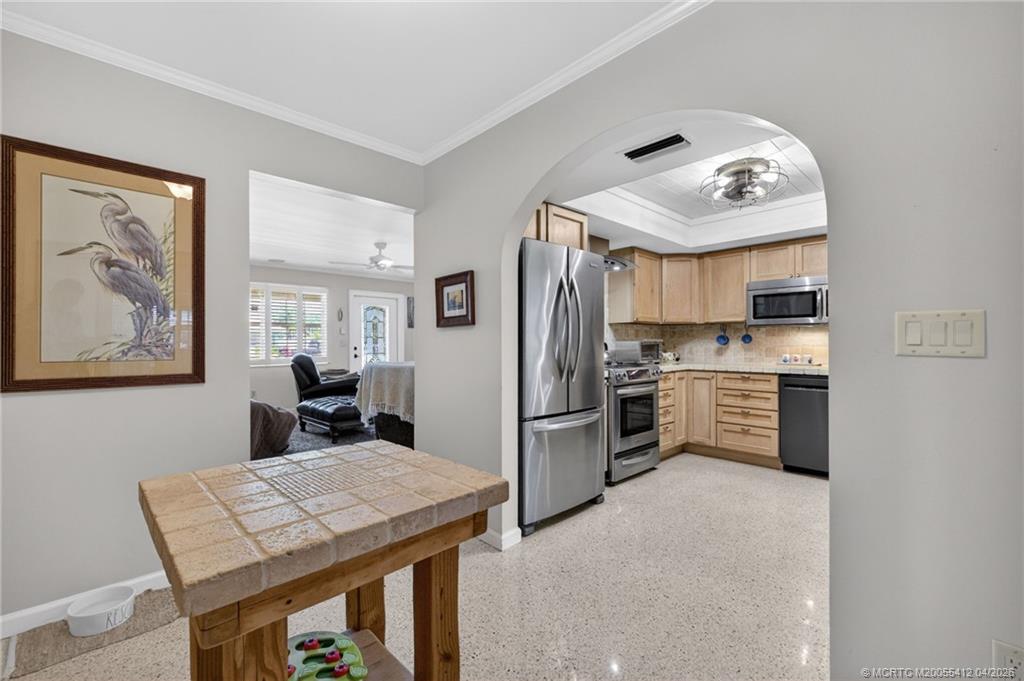 4844 Southeast Pilot Way Stuart, FL 34997 - Photo 30 of 50 a kitchen with refrigerator cabinets and furniture