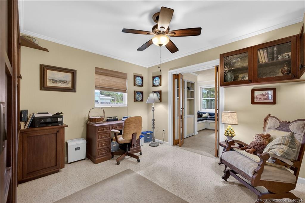 4844 Southeast Pilot Way Stuart, FL 34997 - Photo 38 of 50 a view of a livingroom with workspace and a window
