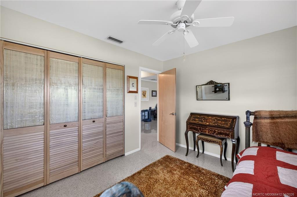 4844 Southeast Pilot Way Stuart, FL 34997 - Photo 43 of 50 a view of a livingroom with furniture and a ceiling fan
