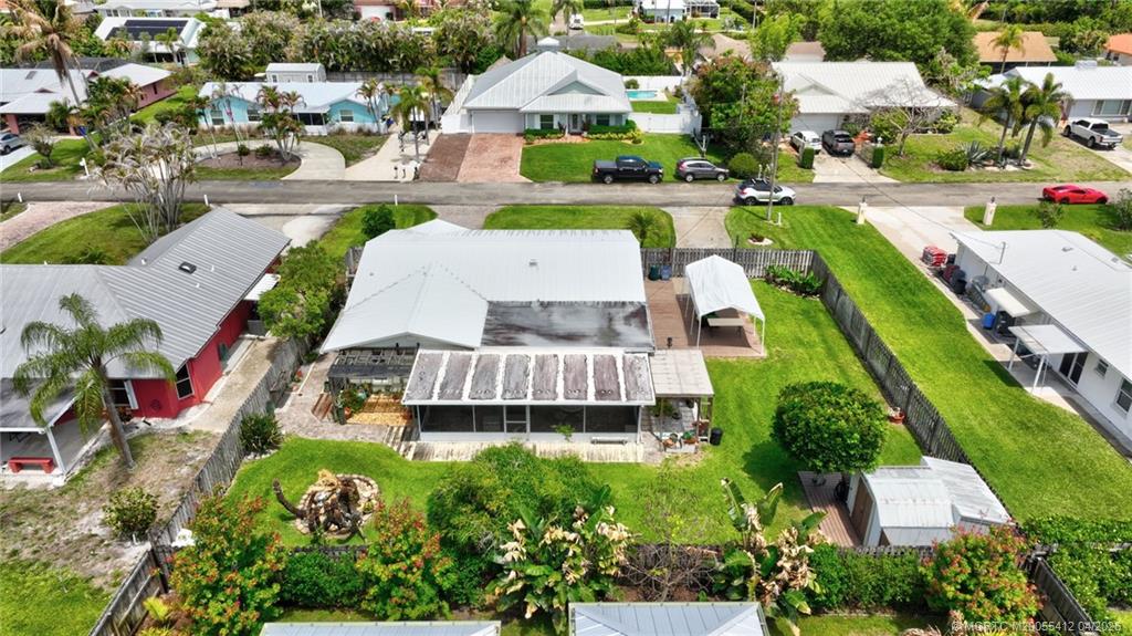 4844 Southeast Pilot Way Stuart, FL 34997 - Photo 50 of 50 an aerial view of a house with outdoor space pool patio yard and lake view