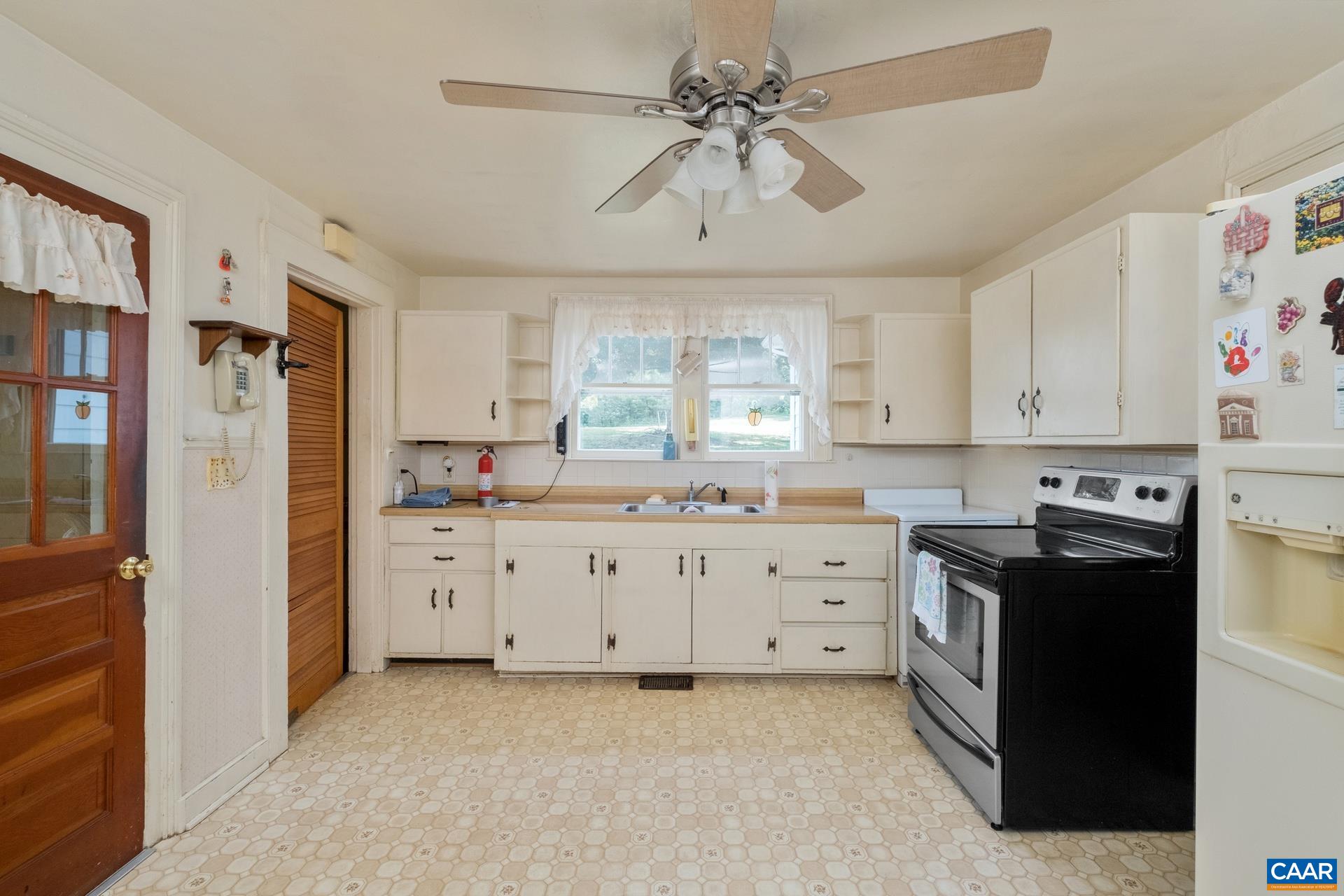 165 Shiloh Loop Faber, VA 22938 - Photo 14 of 33 a kitchen with cabinets appliances and a window