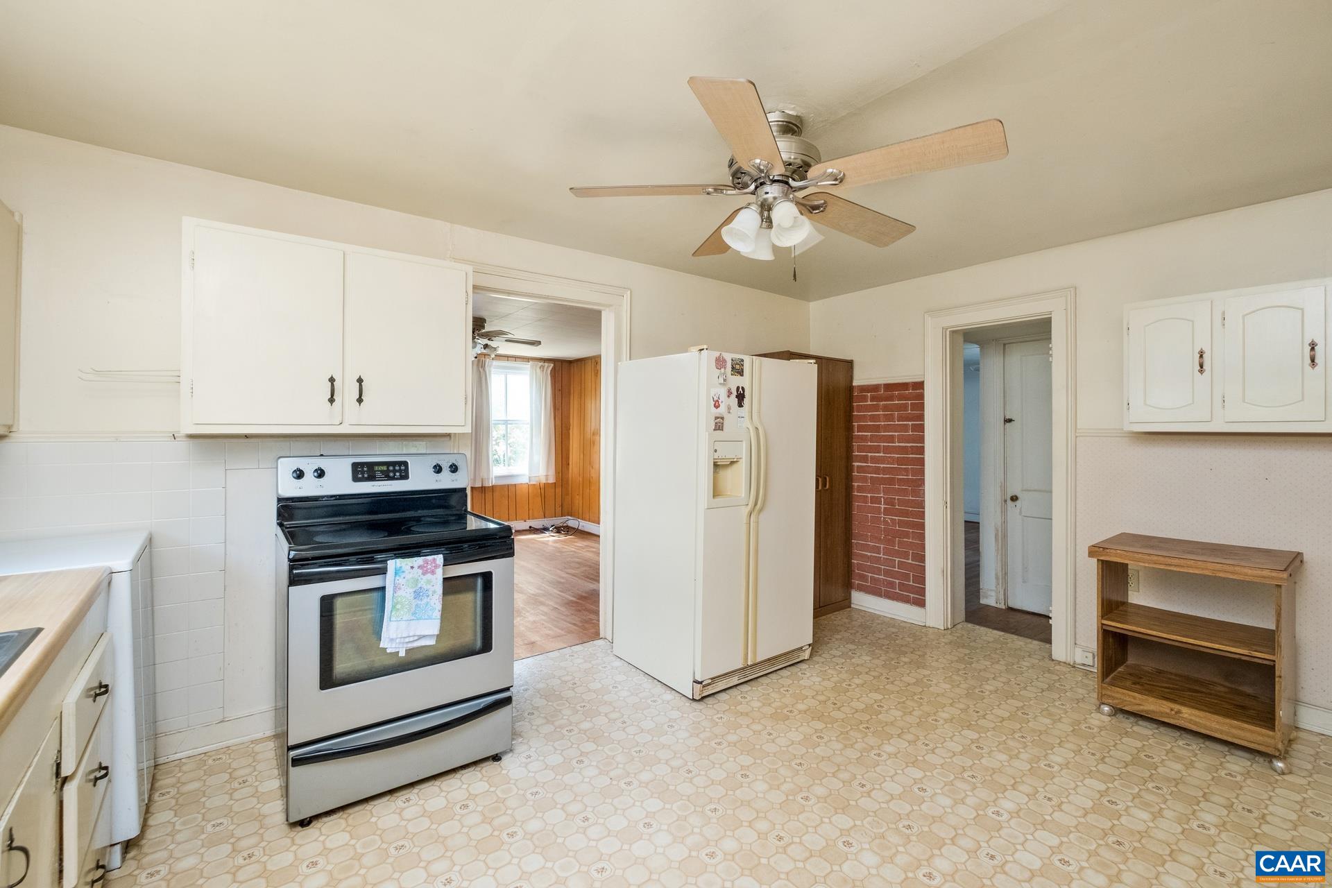 165 Shiloh Loop Faber, VA 22938 - Photo 15 of 33 a view of a kitchen with refrigerator stove and cabinets