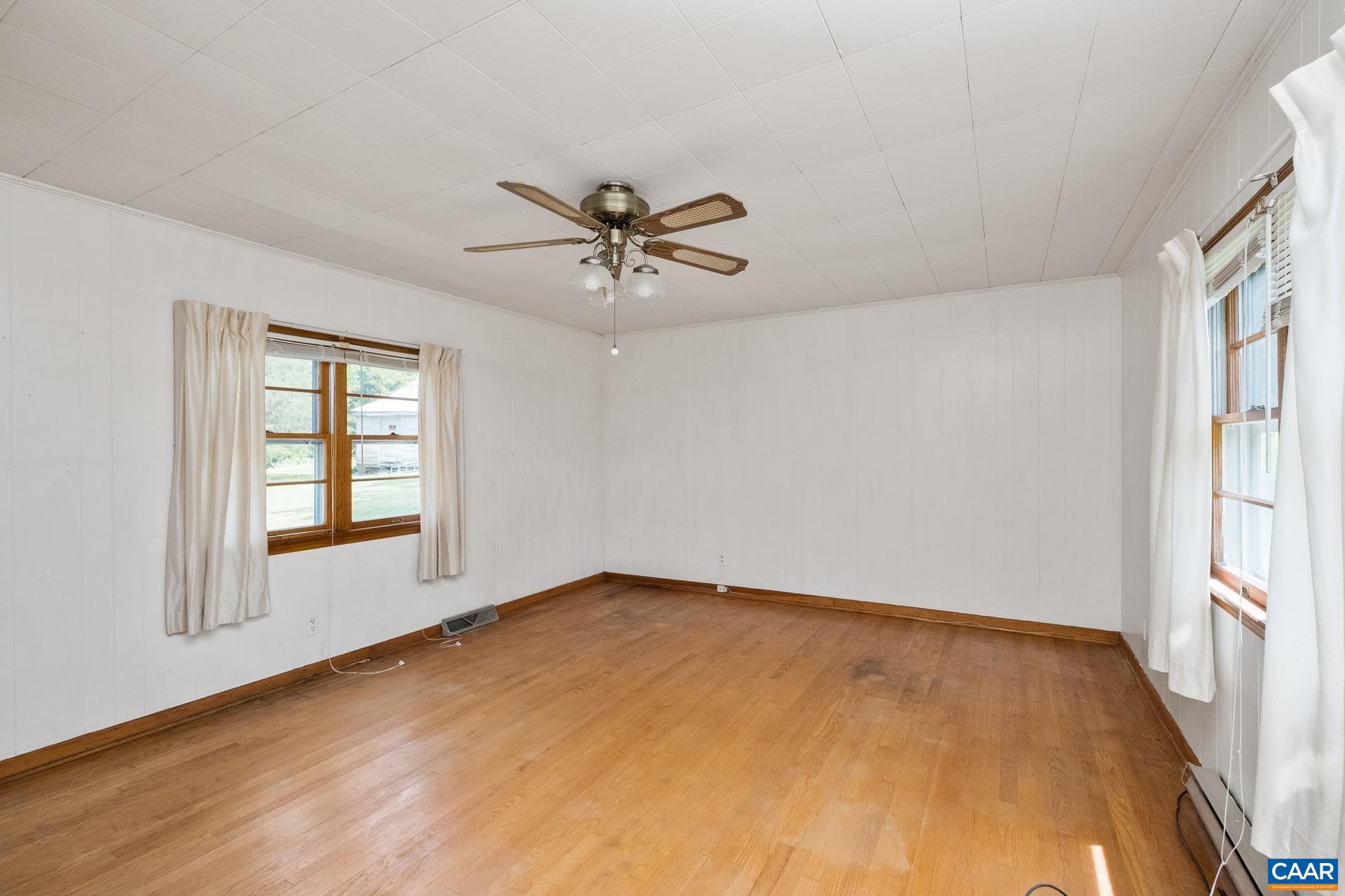 165 Shiloh Loop Faber, VA 22938 - Photo 20 of 33 wooden floor in an empty room with a window