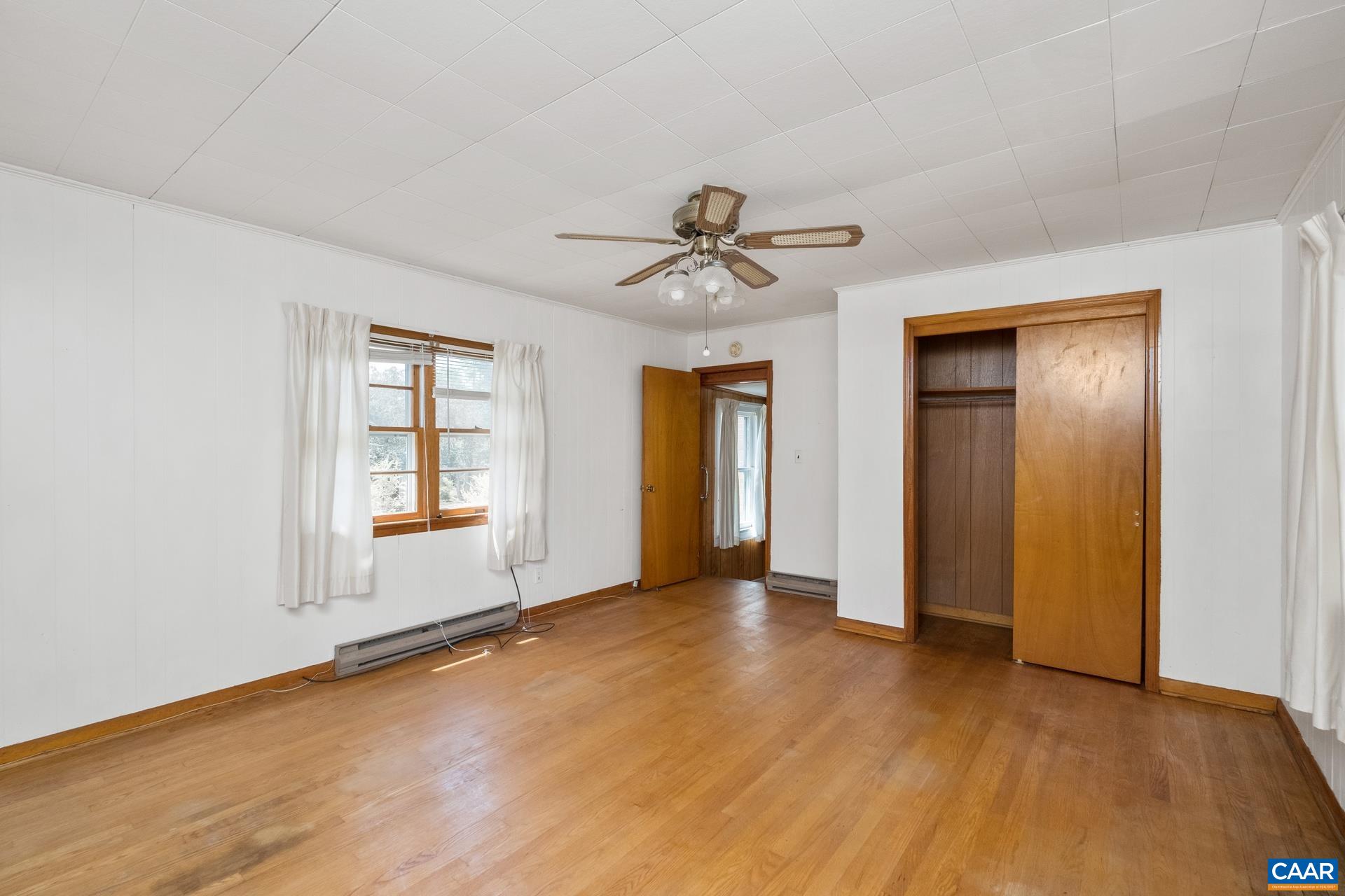 165 Shiloh Loop Faber, VA 22938 - Photo 21 of 33 wooden floor in an empty room with a window
