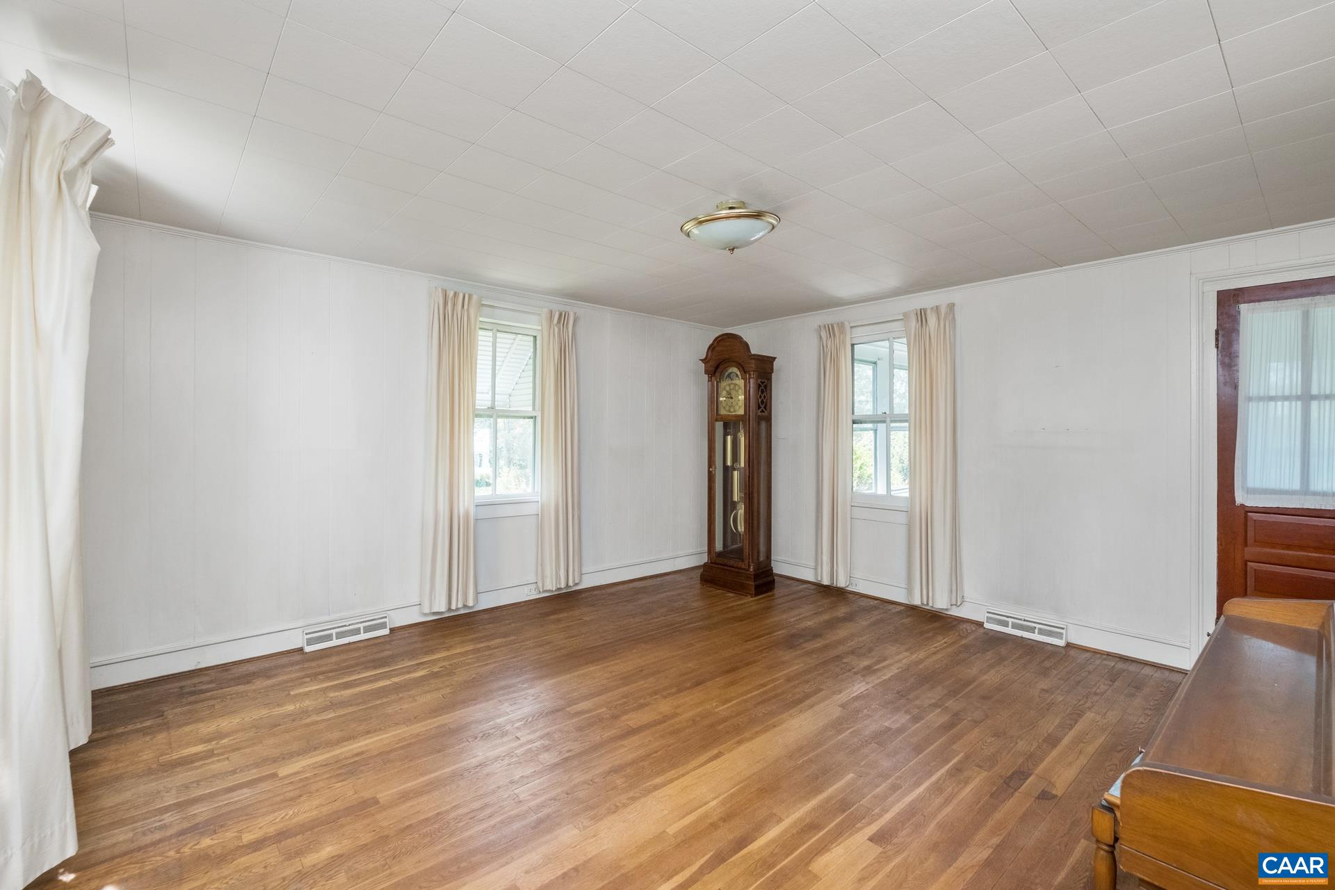 165 Shiloh Loop Faber, VA 22938 - Photo 22 of 33 a view of an empty room with wooden floor and window