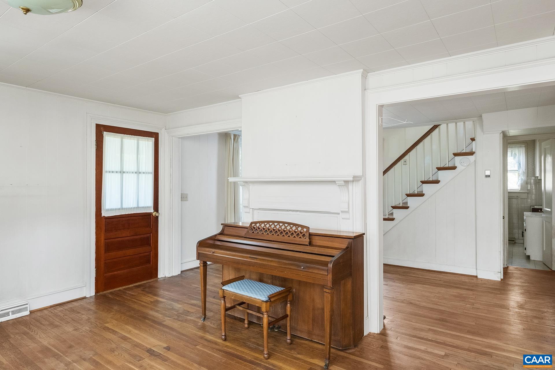 165 Shiloh Loop Faber, VA 22938 - Photo 24 of 33 a view of entryway with wooden floor and staircase