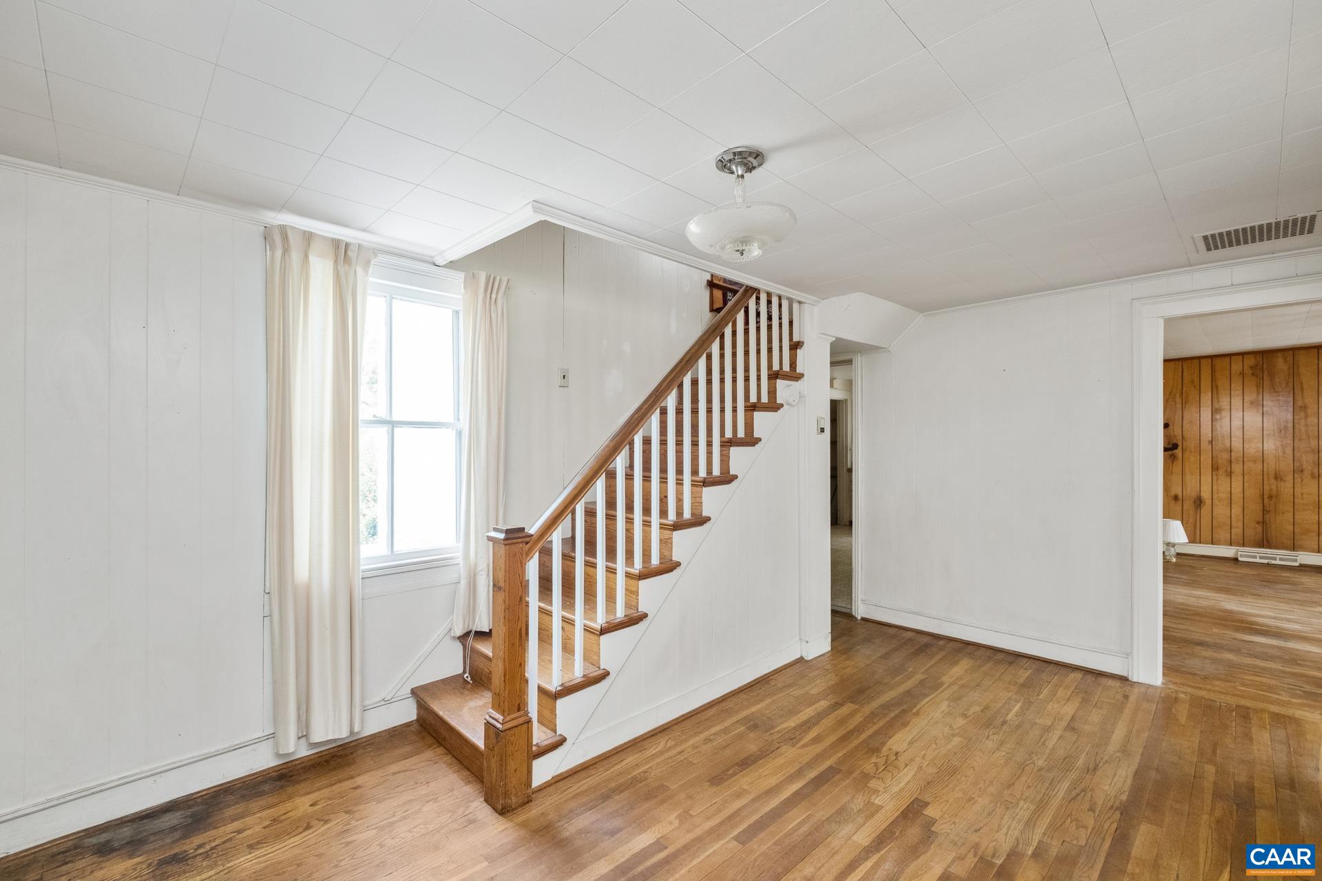 165 Shiloh Loop Faber, VA 22938 - Photo 25 of 33 a view of a hallway with wooden floor and entryway