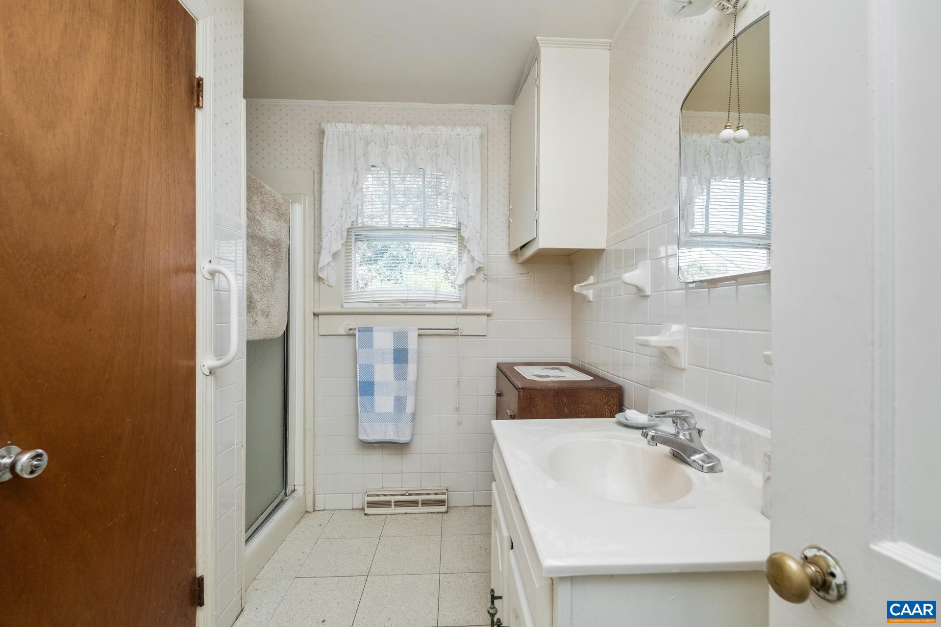 165 Shiloh Loop Faber, VA 22938 - Photo 26 of 33 a bathroom with a sink and a mirror