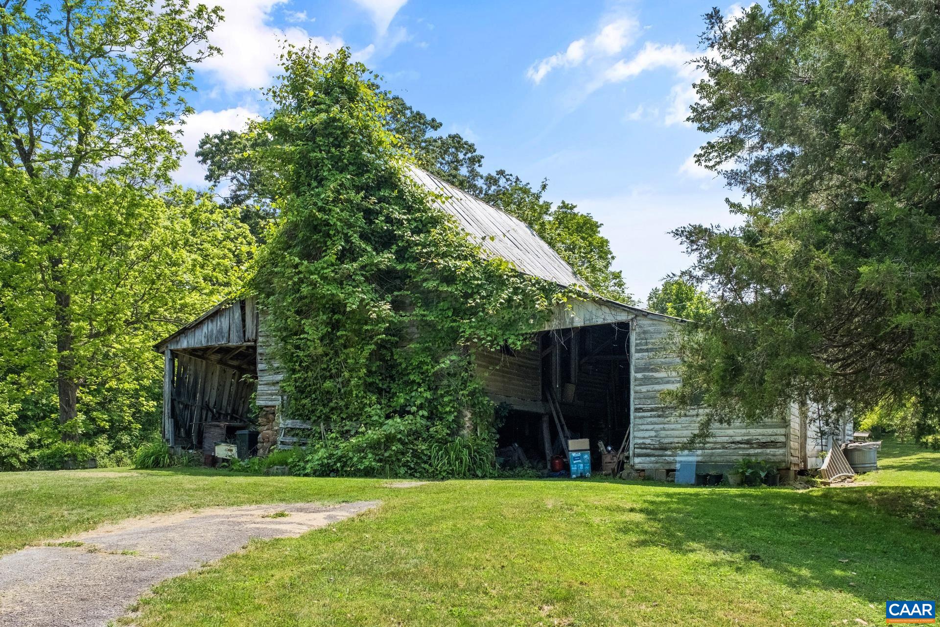 165 Shiloh Loop Faber, VA 22938 - Photo 3 of 33 a view of a house with a yard and a large tree