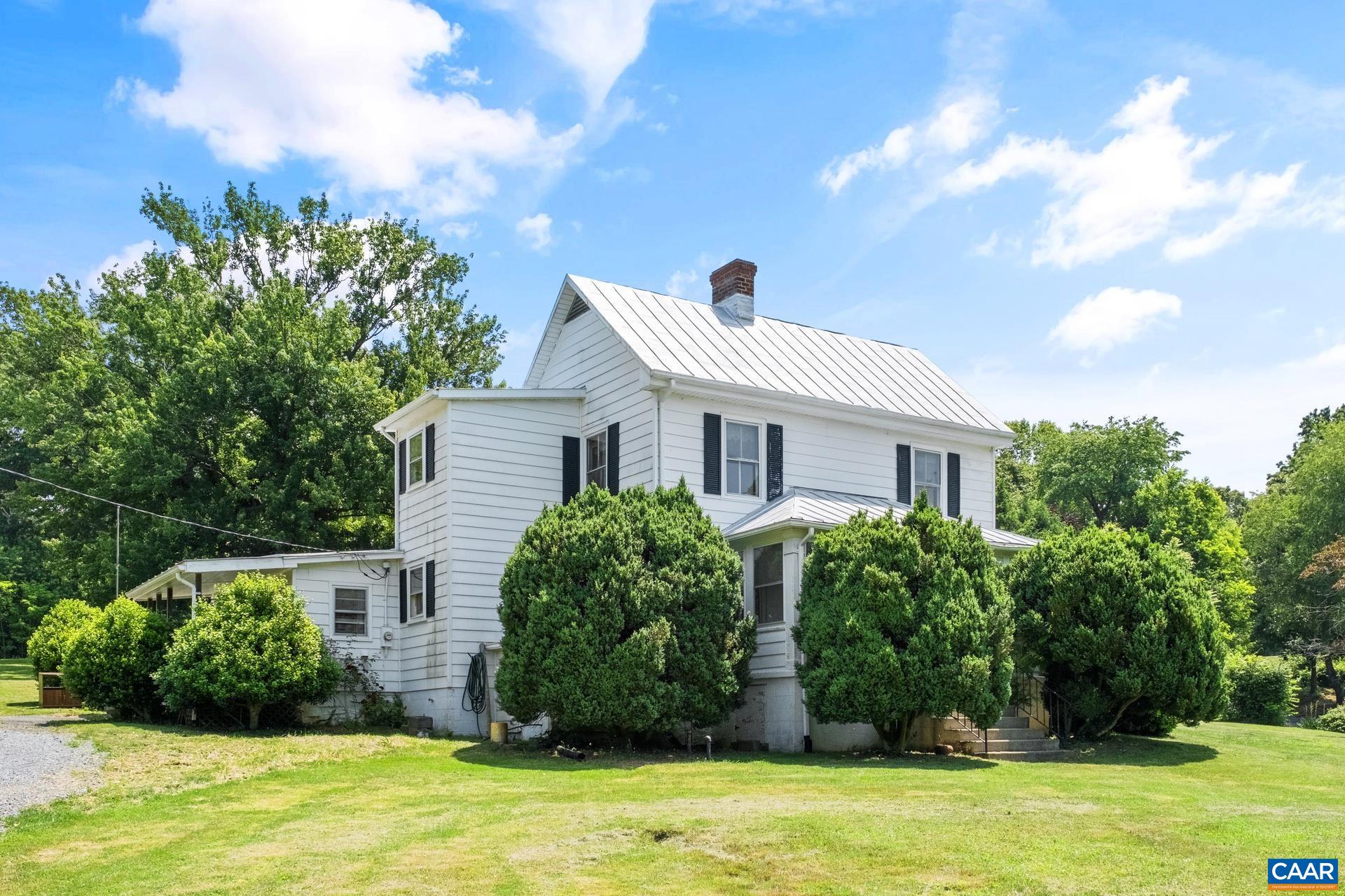 165 Shiloh Loop Faber, VA 22938 - Photo 6 of 33 a view of a white house with a big yard and potted plants