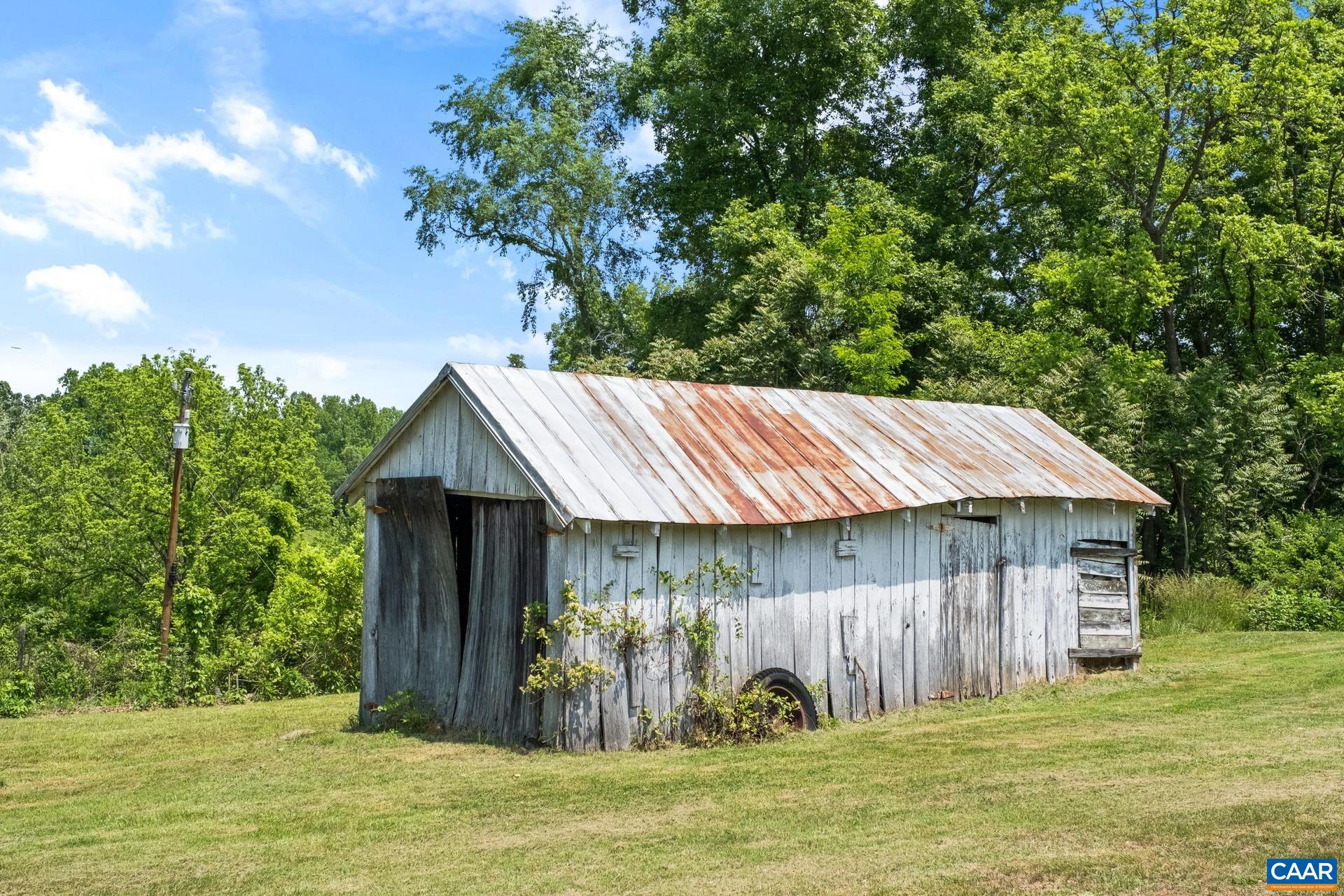 165 Shiloh Loop Faber, VA 22938 - Photo 9 of 33 a backyard of a house with table and chairs