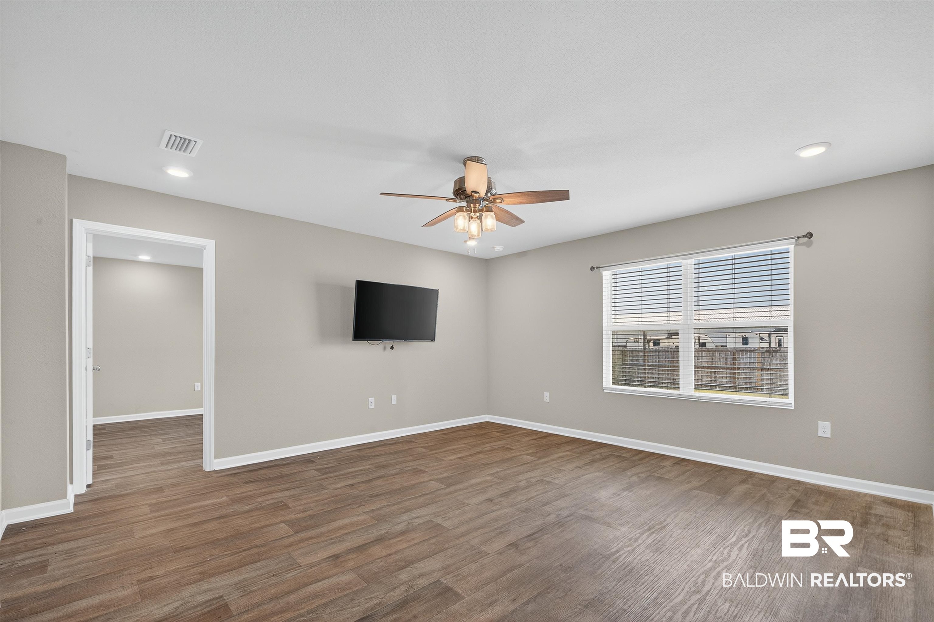 7429 Brompton Drive Foley, AL 36535 - Photo 14 of 50 Unfurnished living room with recessed lighting, wood finished floors, and ceiling fan