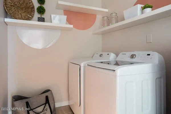 a utility room with dryer and washer