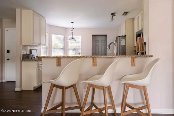 a view of kitchen with breakfast area