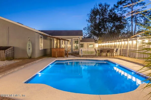 a view of swimming pool with outdoor seating